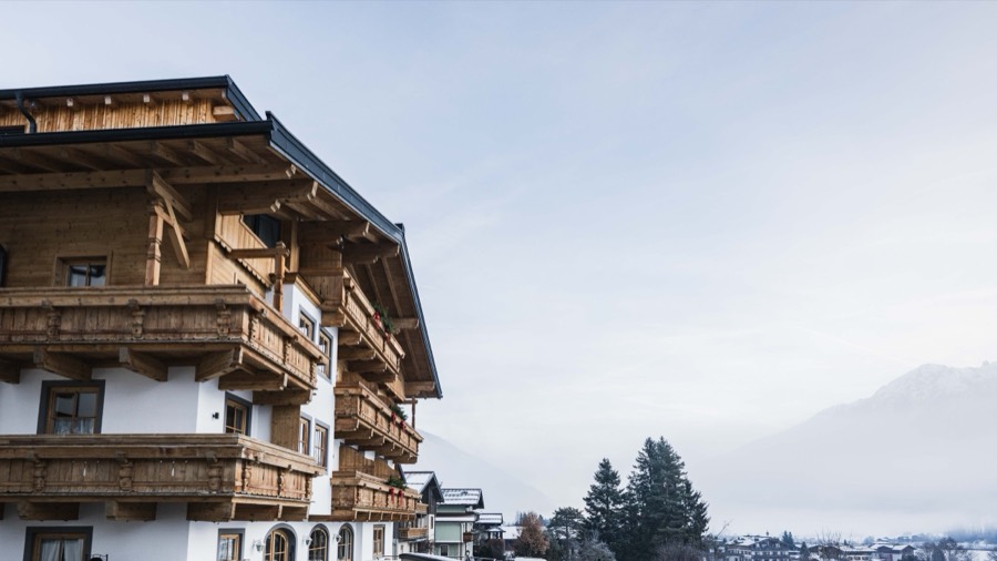 Exterior of Domizil Brugger against the mountain backdrop